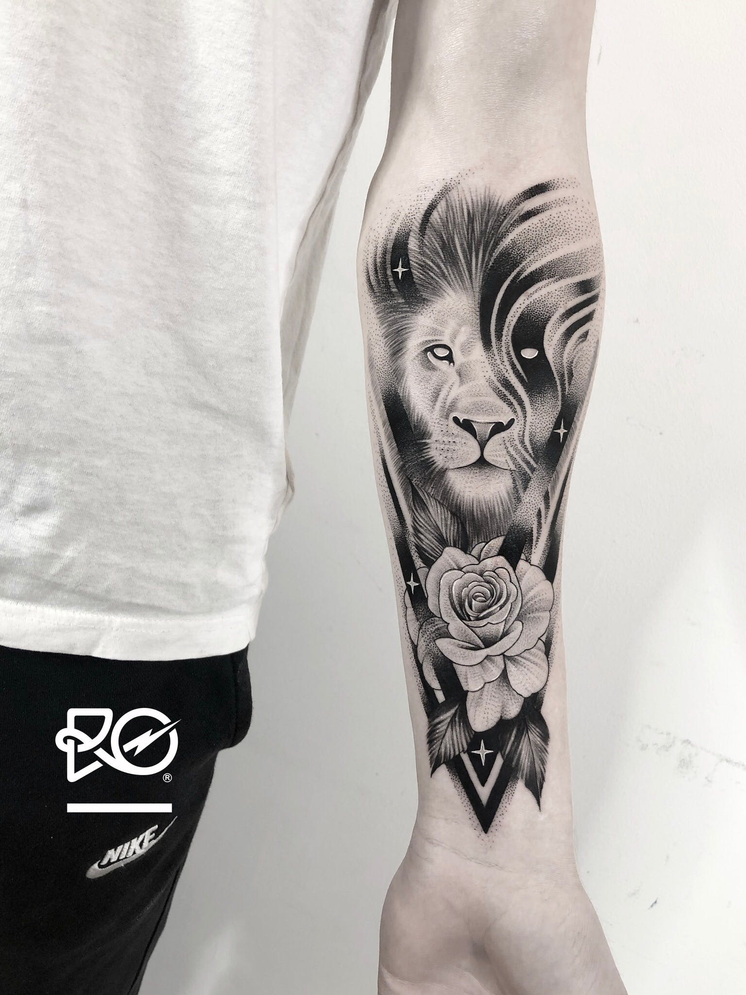 Lion Tattoo Ideas: Mystical Lion and Rose Tattoo on Forearm Tattoo on skin