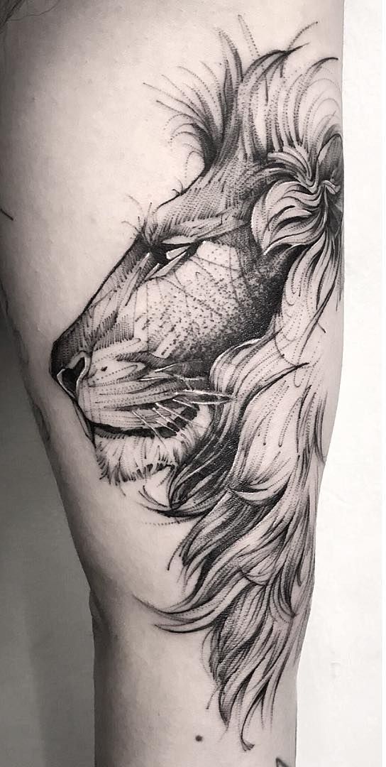 Lion Tattoo Ideas: Side Facing Lion Head Tattoo on Leg Tattoo on skin