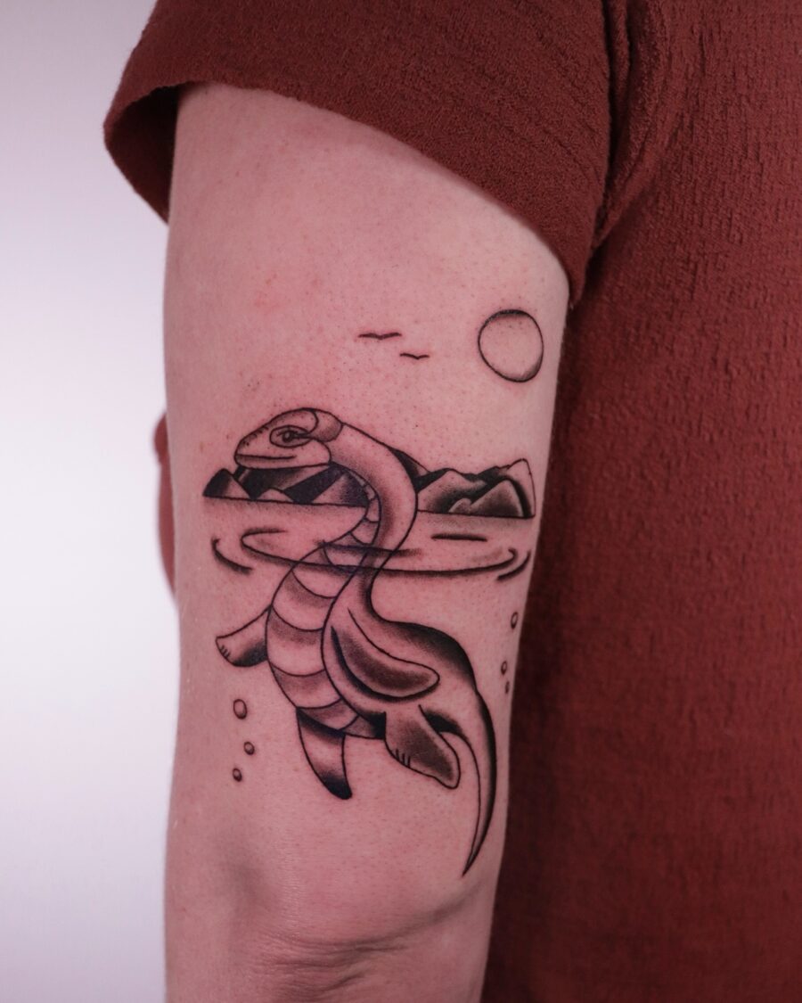 Artistic interpretation of the Loch Ness Monster tattoo. Tattoo on skin