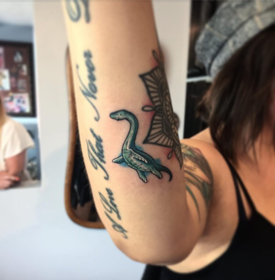 Charming Loch Ness Monster Tattoo in Color Tattoo on skin