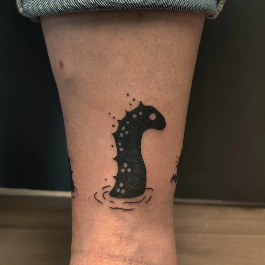 Charming Loch Ness Monster Tattoo on Ankle Tattoo on skin
