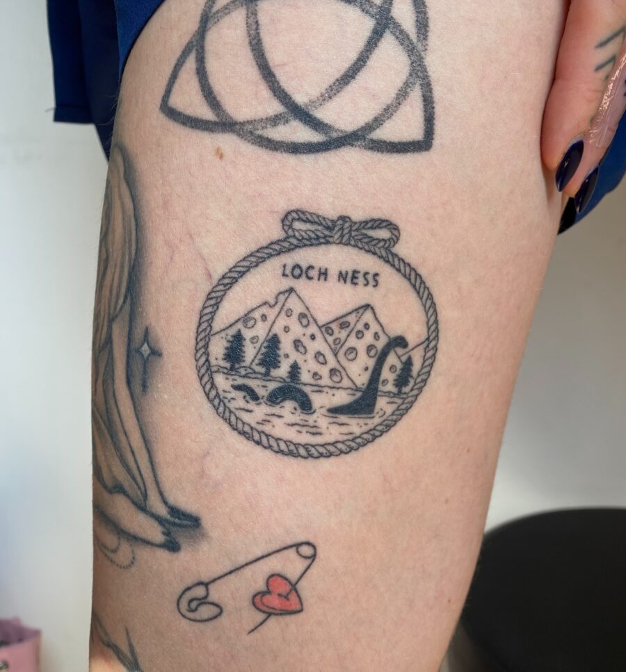 Charming Loch Ness Tattoo with Scenic Elements Tattoo on skin