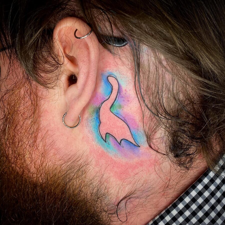 Colorful Loch Ness Monster Ear Tattoo Tattoo on skin