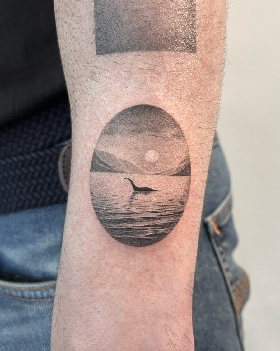 Elegant loch ness monster tattoo in serene setting Tattoo on skin