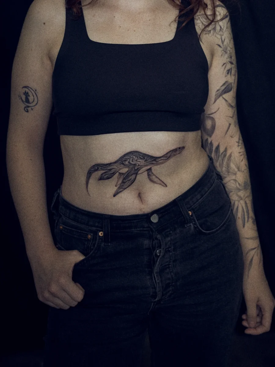 Elegant Loch Ness Monster Tattoo on Stomach Tattoo on skin