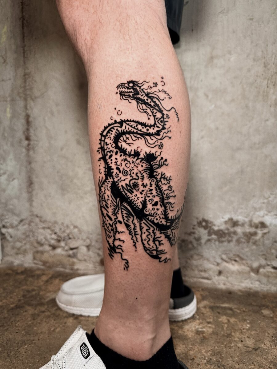 Intricate Loch Ness Monster Tattoo Design Tattoo on skin