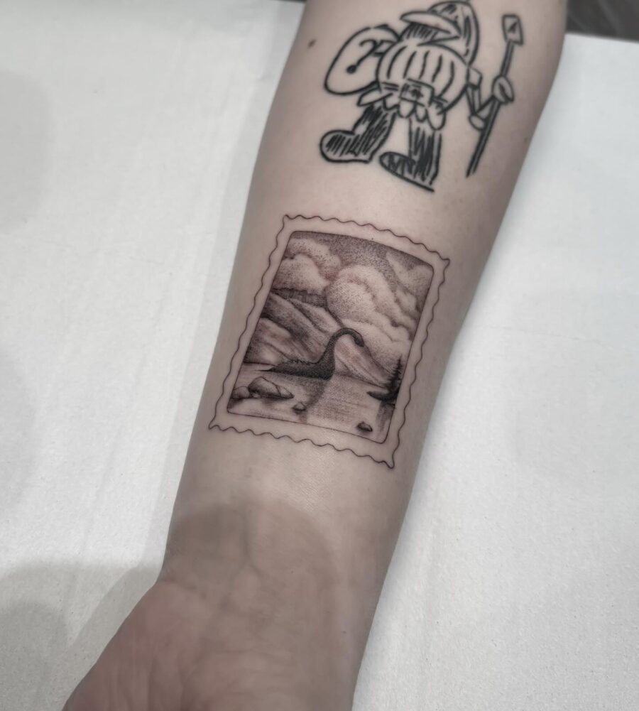 Intricate stamp-style Loch Ness monster tattoo Tattoo on skin