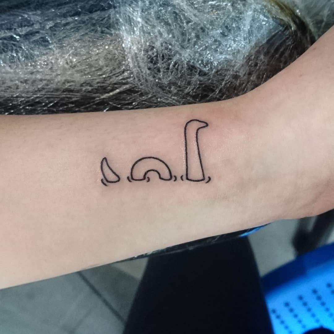 Minimalist Loch Ness Monster Tattoo Design Tattoo on skin