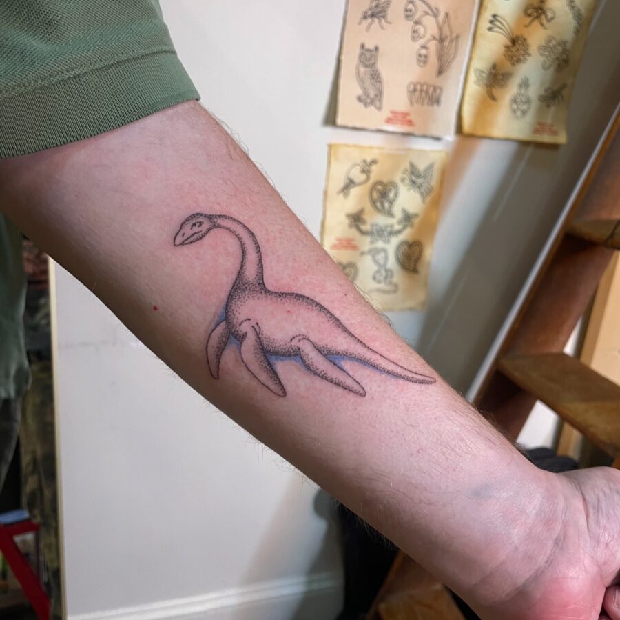 Minimalist Loch Ness Monster Tattoo Design Tattoo on skin