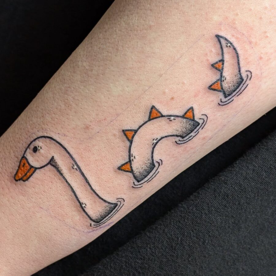Playful Loch Ness Monster Tattoo Design Tattoo on skin