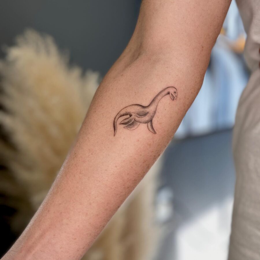 Stylish Loch Ness Monster Arm Tattoo Design Tattoo on skin