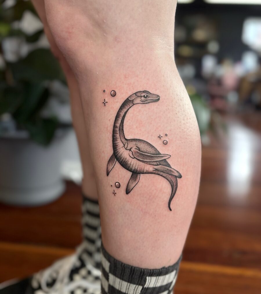 Stylish Loch Ness Monster Tattoo in Black Ink Tattoo on skin