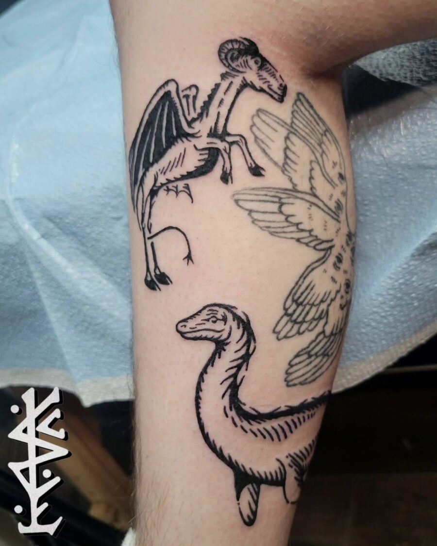 Unique Loch Ness Monster and Winged Creatures Tattoo Tattoo on skin