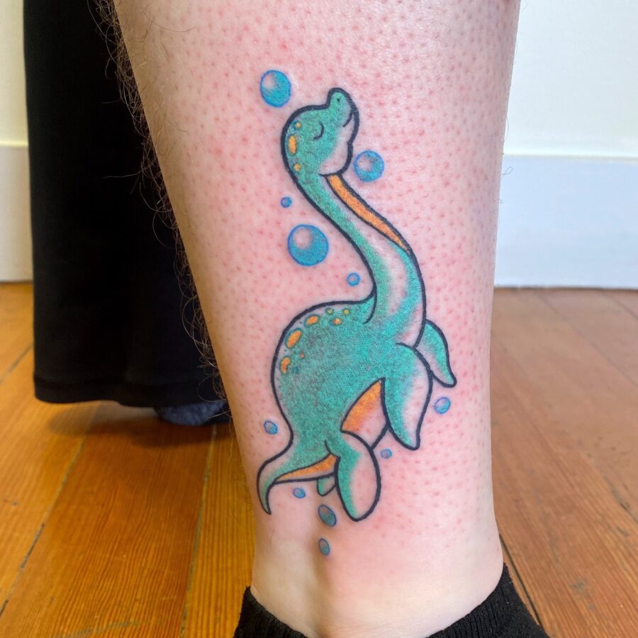 Vibrant Loch Ness Monster Tattoo for Adventure Seekers Tattoo on skin