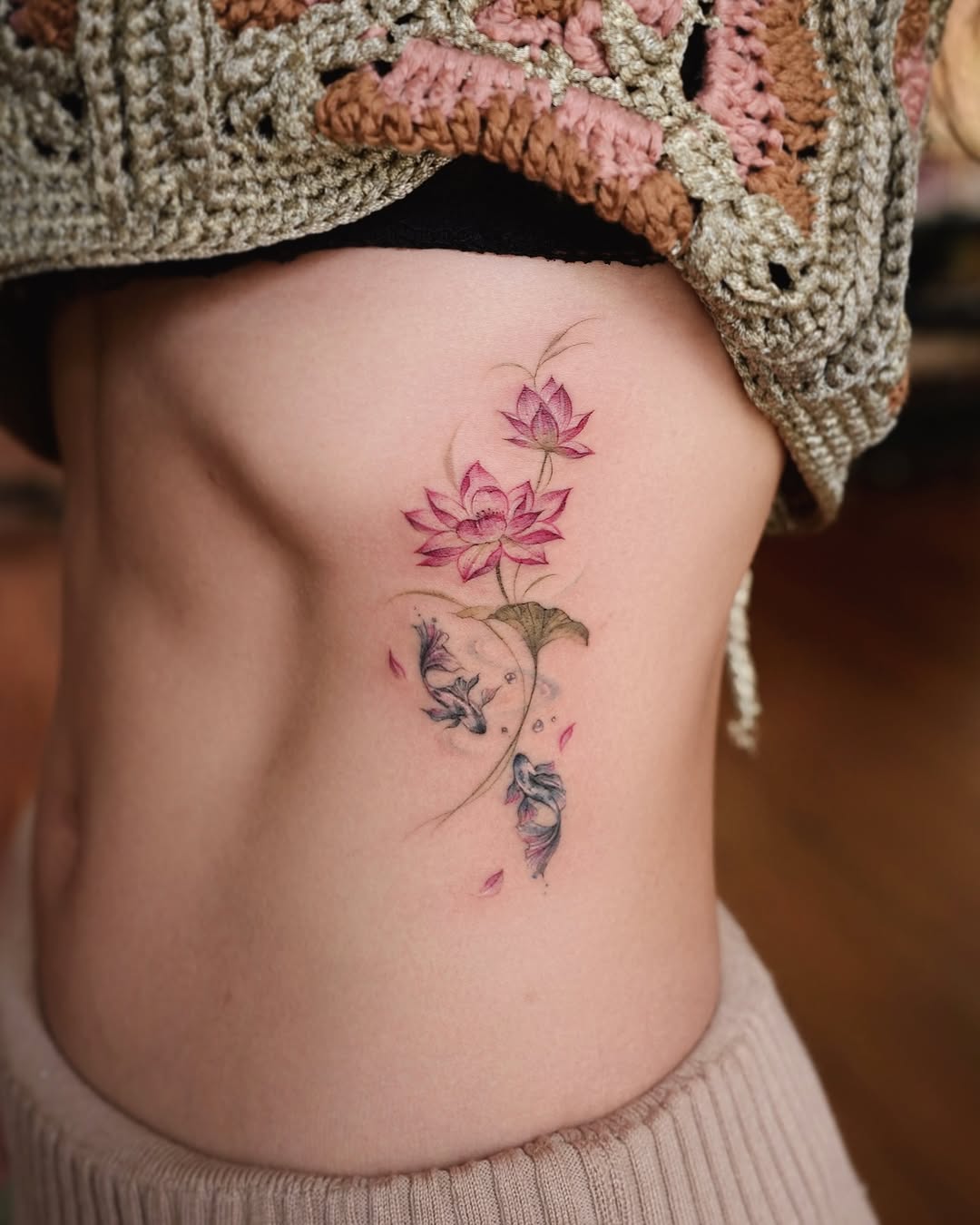 Delicate lotus tattoo with a floral touch Tattoo on skin