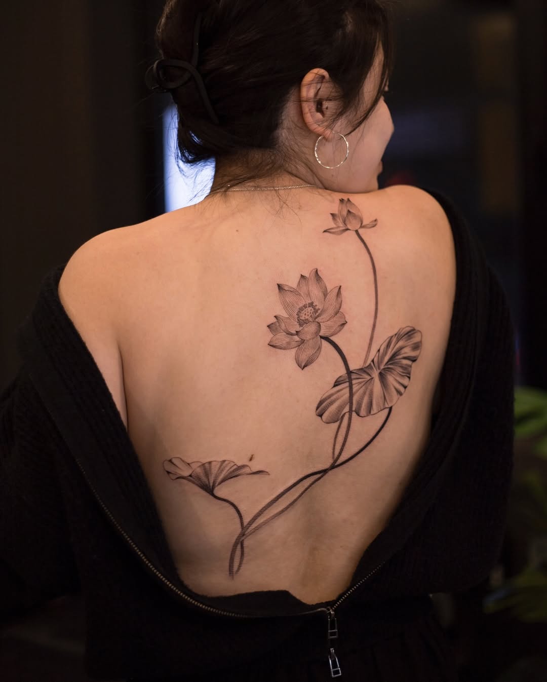 Elegant Lotus Tattoo Gracefully Adorning the Back Tattoo on skin