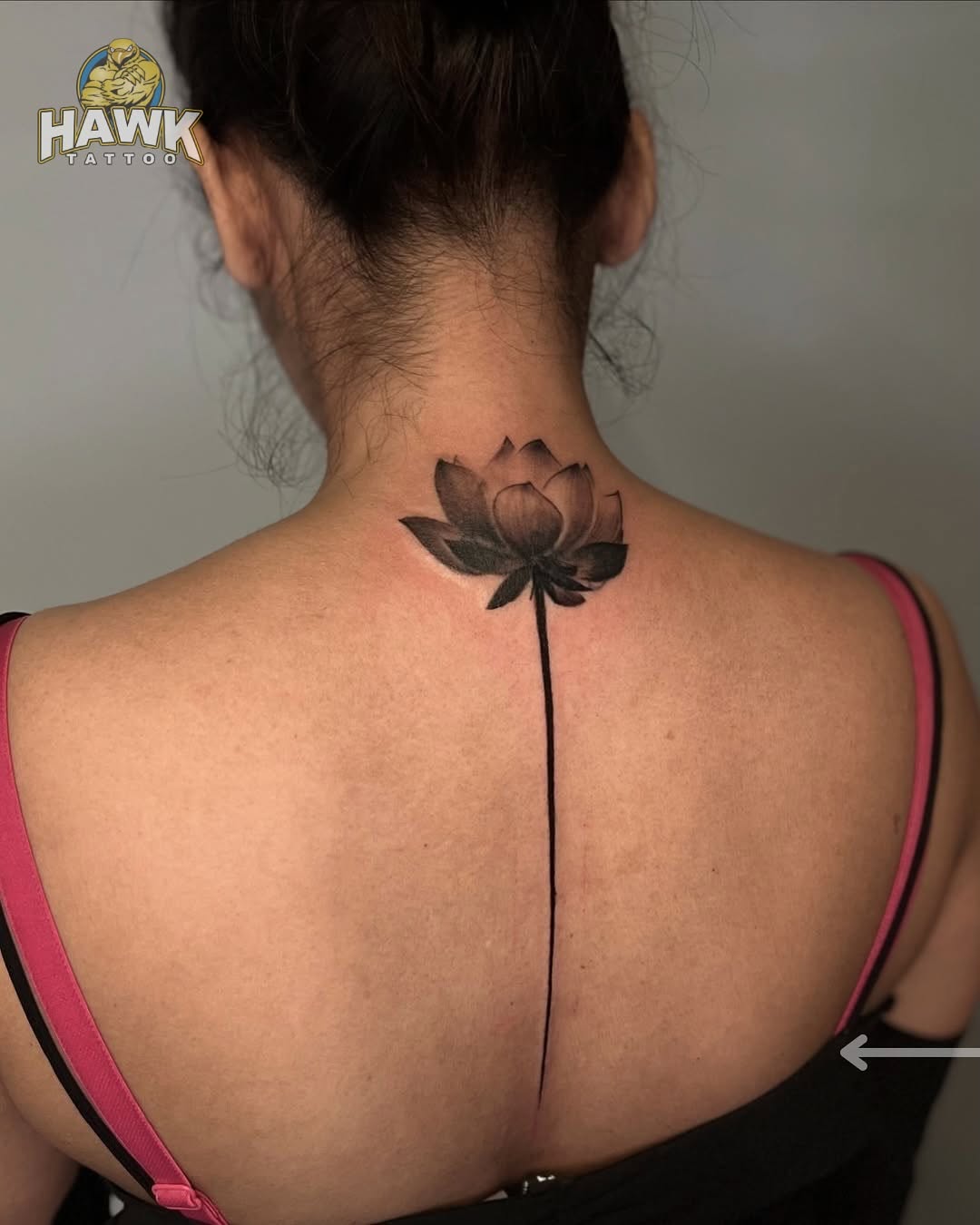 Elegant lotus tattoo on the back Tattoo on skin