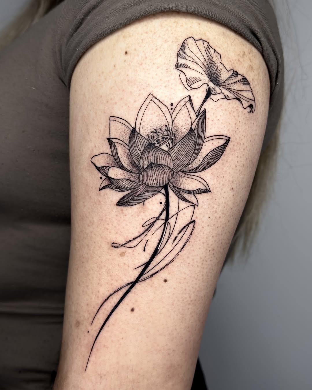 Elegant lotus tattoo with delicate floral details Tattoo on skin