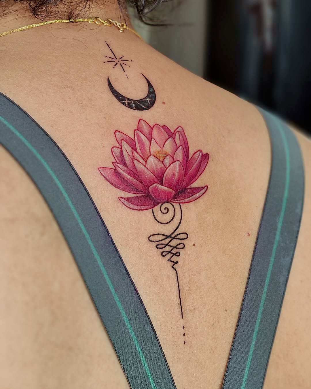 Elegant lotus tattoo with moon accent Tattoo on skin