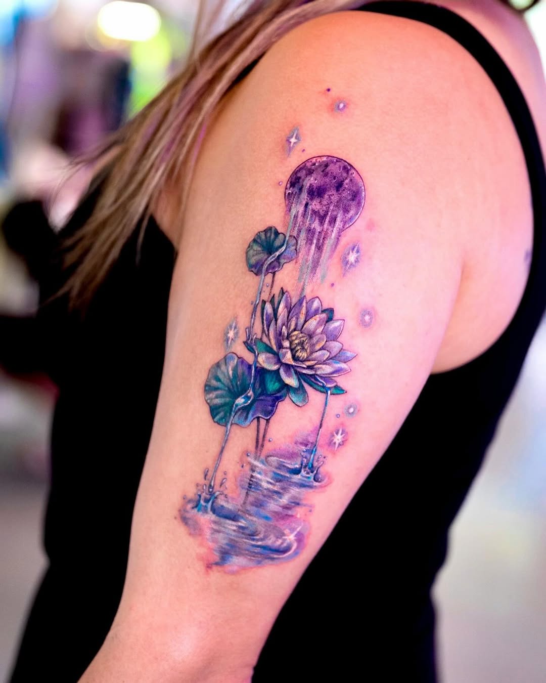 Stunning lotus tattoo with a celestial vibe Tattoo on skin