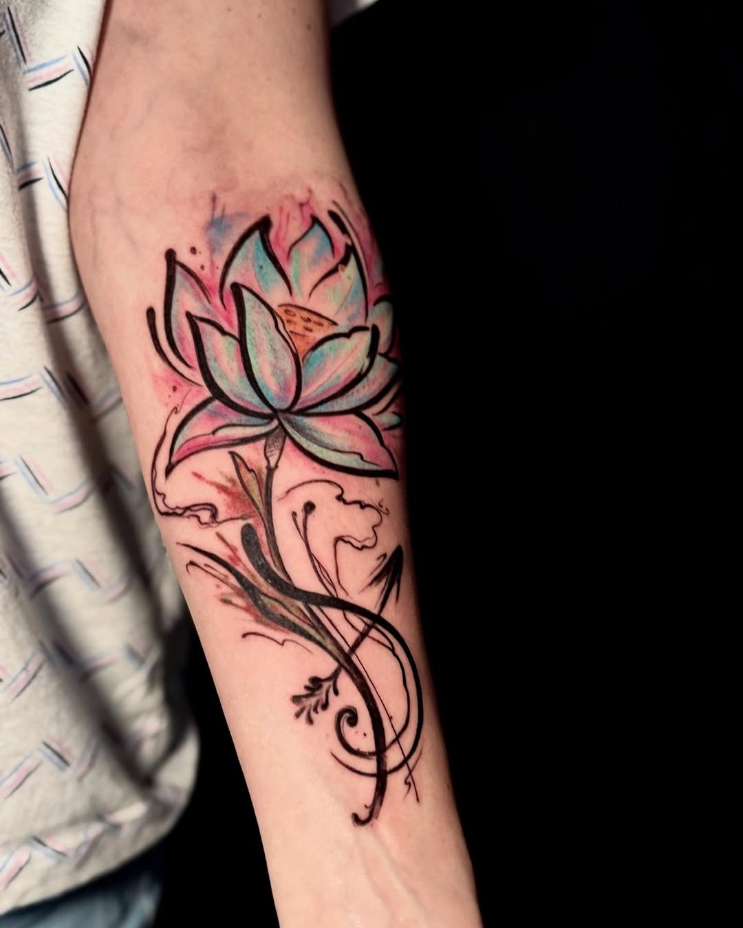 Vibrant lotus tattoo with flowing elegance Tattoo on skin