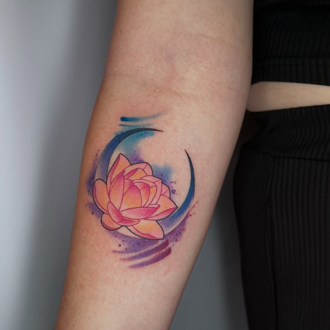 Vibrant lotus tattoo with watercolor elements Tattoo on skin