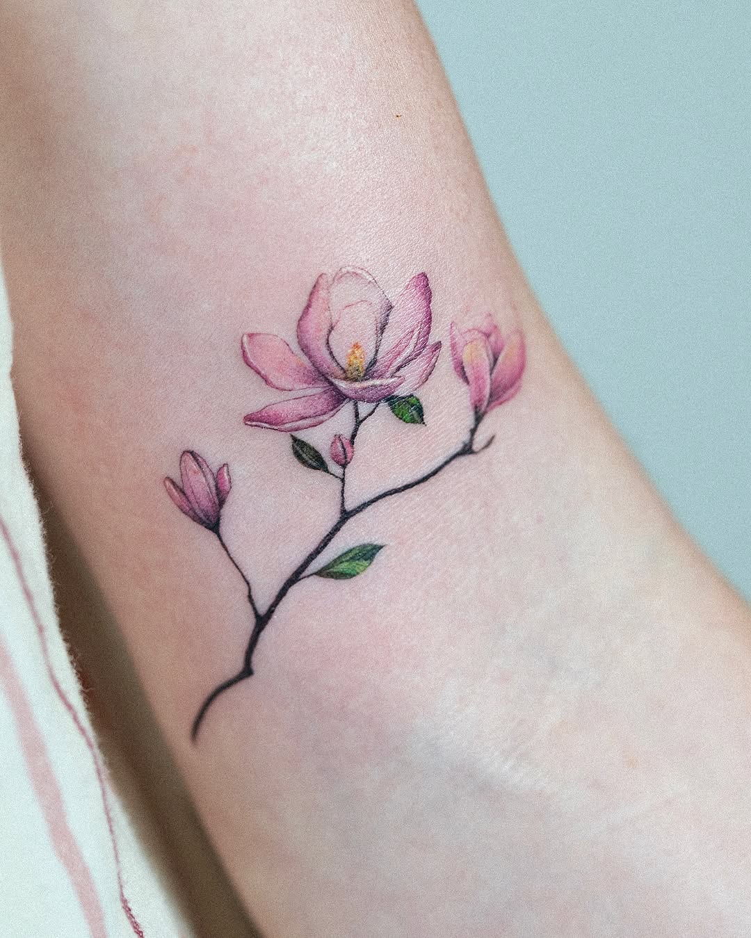 Delicate Magnolia Tattoo on Ankle Tattoo on skin