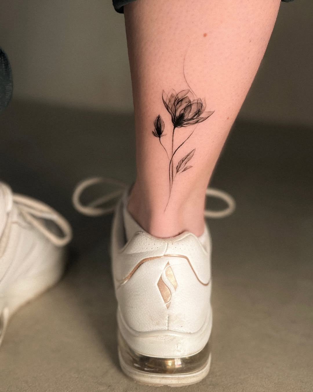 Delicate Magnolia Tattoo on Ankle Tattoo on skin