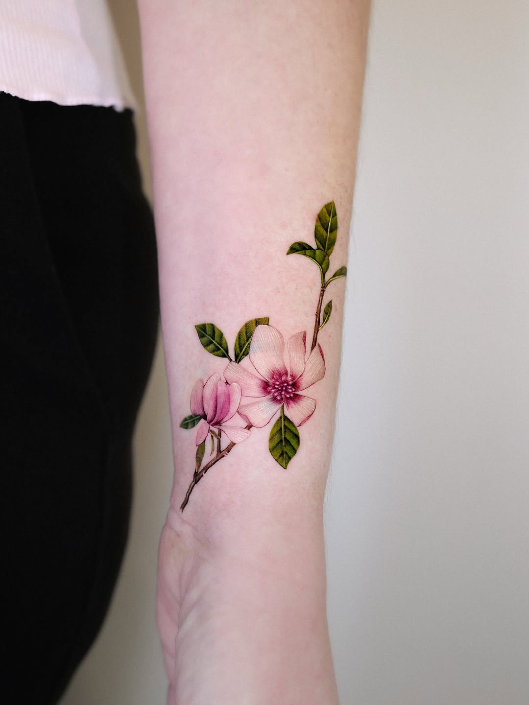 Delicate magnolia tattoo showcasing floral beauty Tattoo on skin