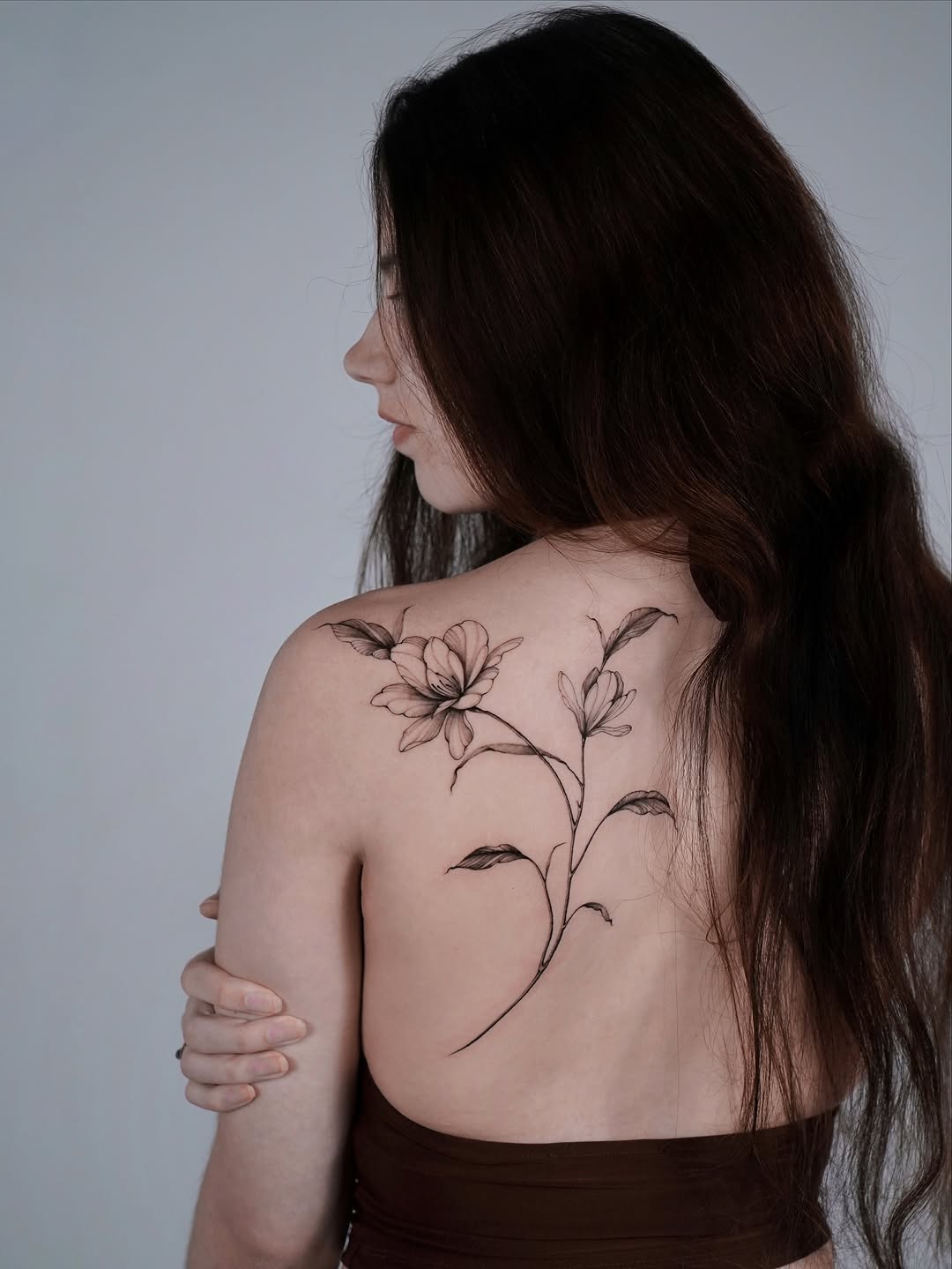 Elegant Magnolia Tattoo on the Back Tattoo on skin
