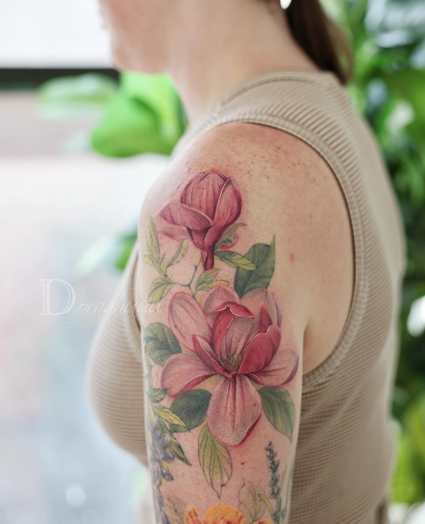 Elegant magnolia tattoo showcasing natural beauty Tattoo on skin