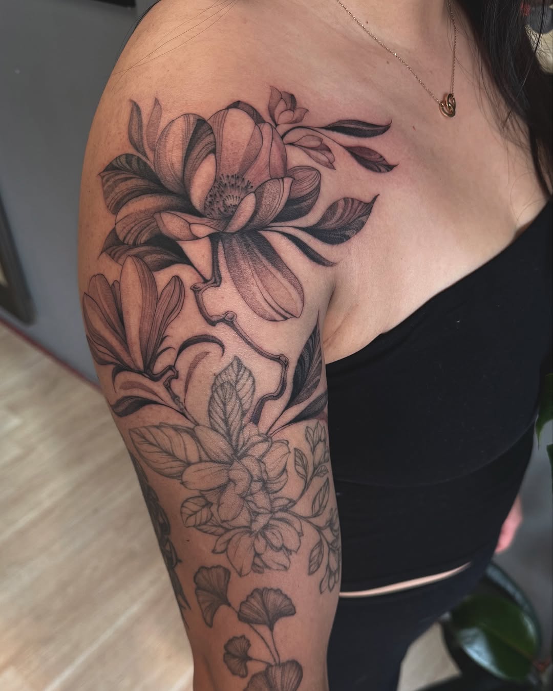 Elegant Magnolia Tattoo Sleeve on Arm Tattoo on skin
