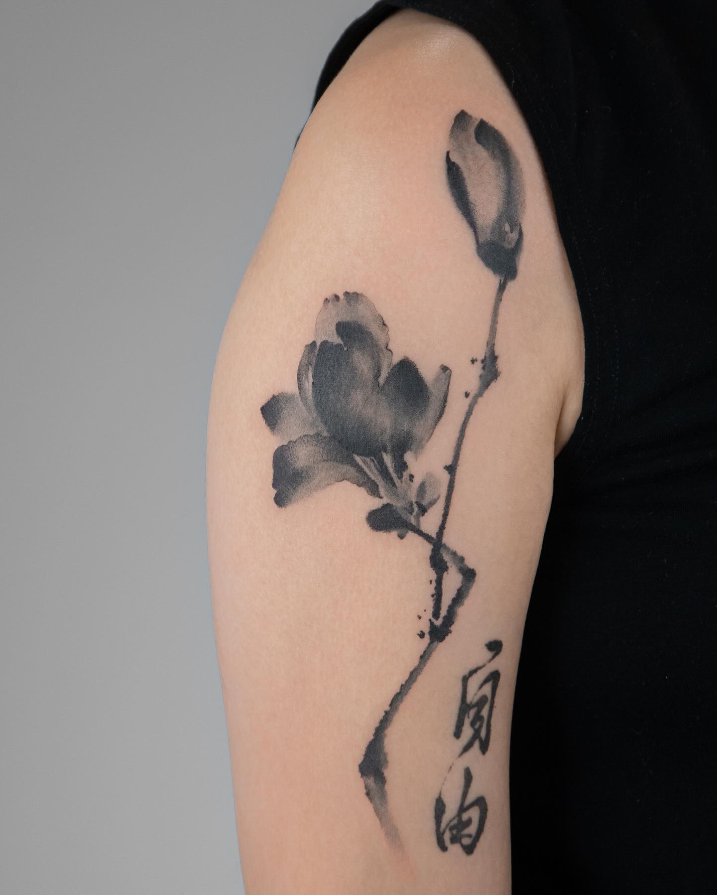 Elegant monochrome magnolia tattoo illustration Tattoo on skin