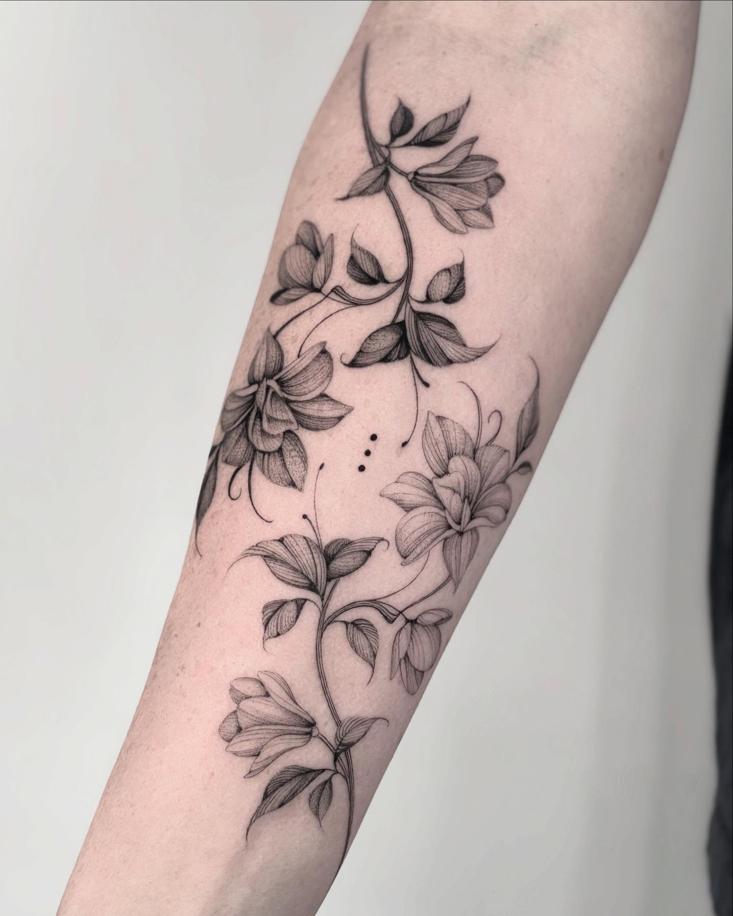 Intricate black and white magnolia tattoo design Tattoo on skin
