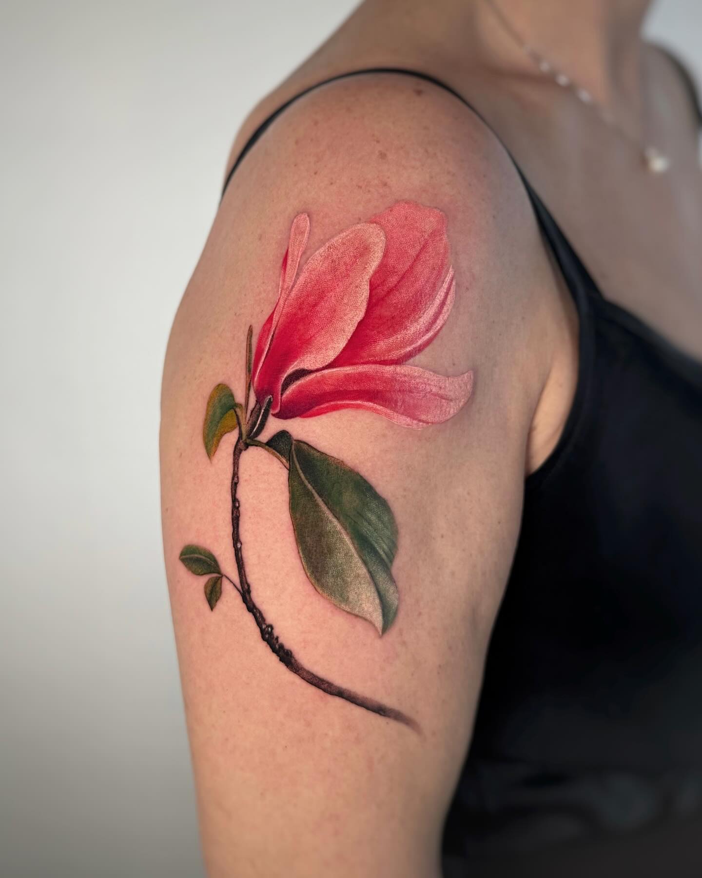 Realistic Magnolia Tattoo on Shoulder Tattoo on skin