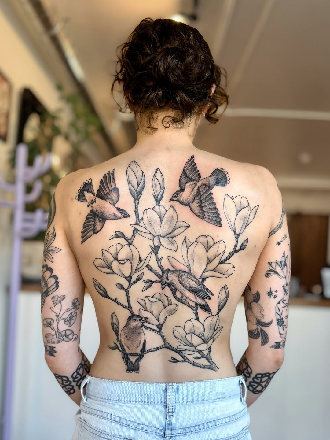 Stunning back tattoo with flora and fauna Tattoo on skin