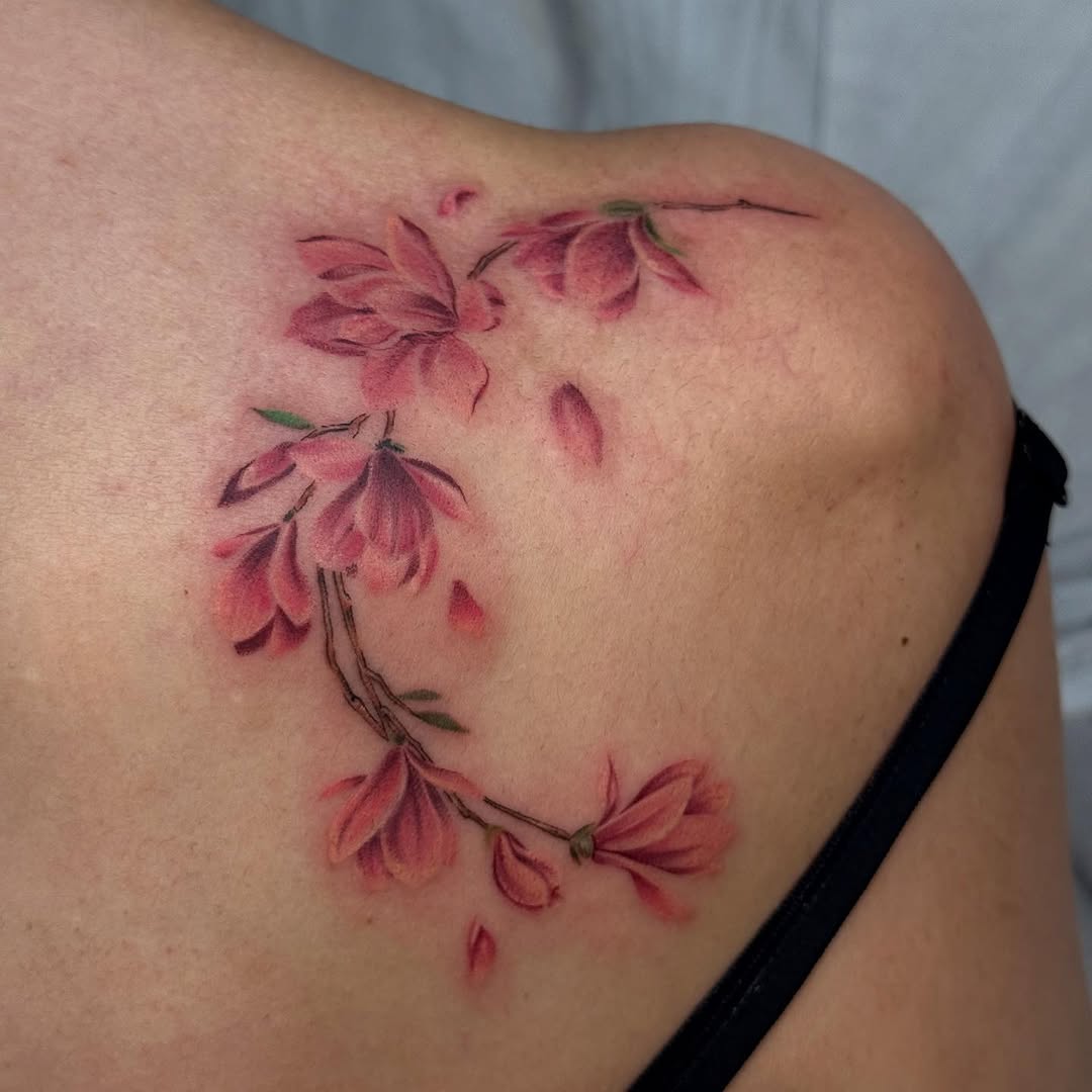 Stunning magnolia tattoo on shoulder Tattoo on skin