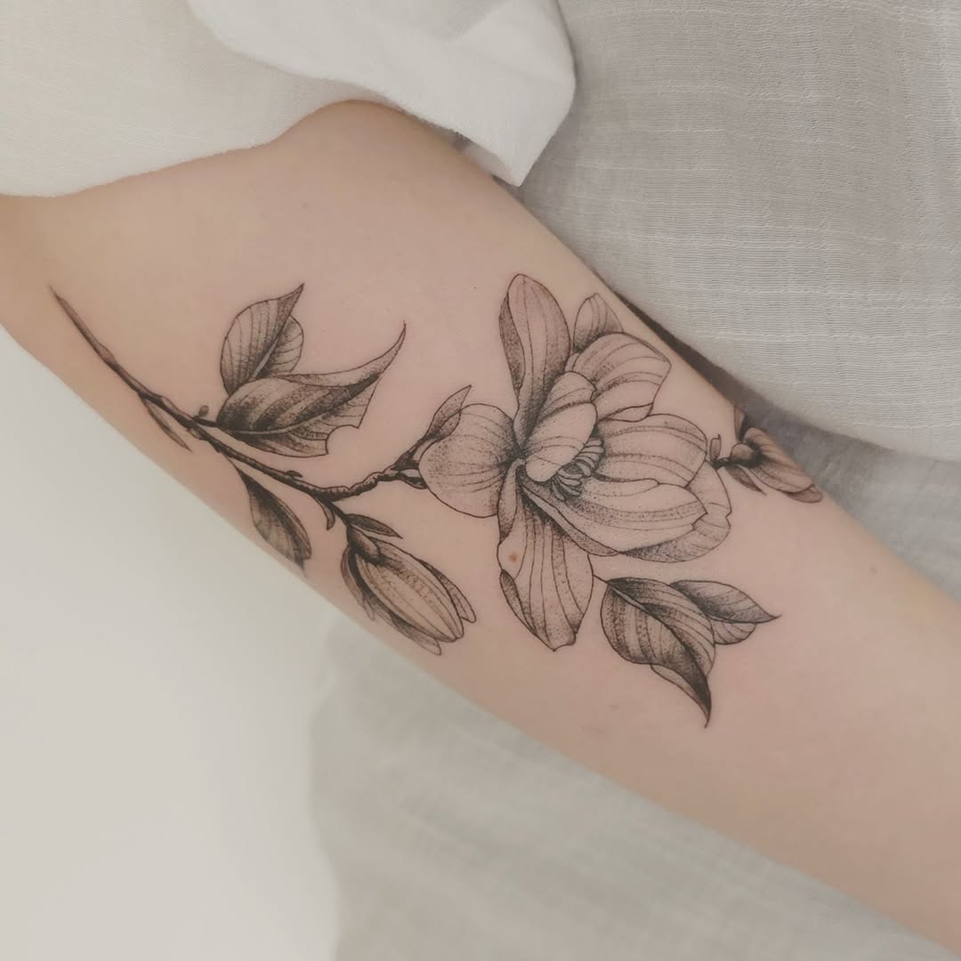 Stunning Magnolia Tattoo with Delicate Lines Tattoo on skin