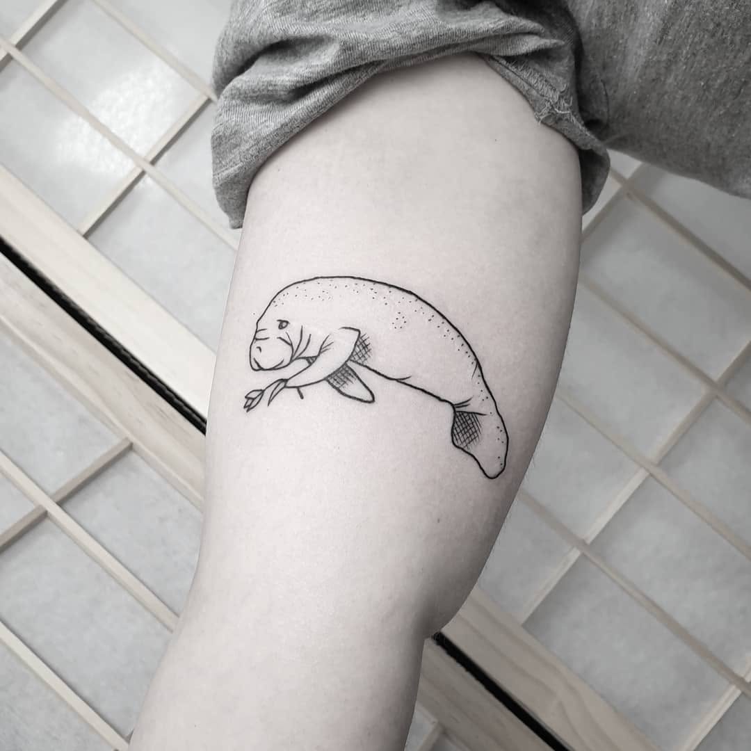 Charming Manatee Tattoo on Thigh Tattoo on skin