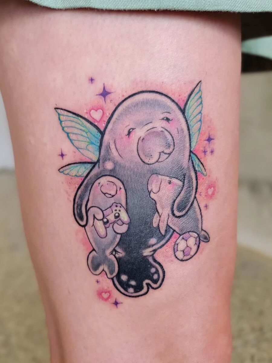 Charming manatee tattoo with a nurturing vibe Tattoo on skin