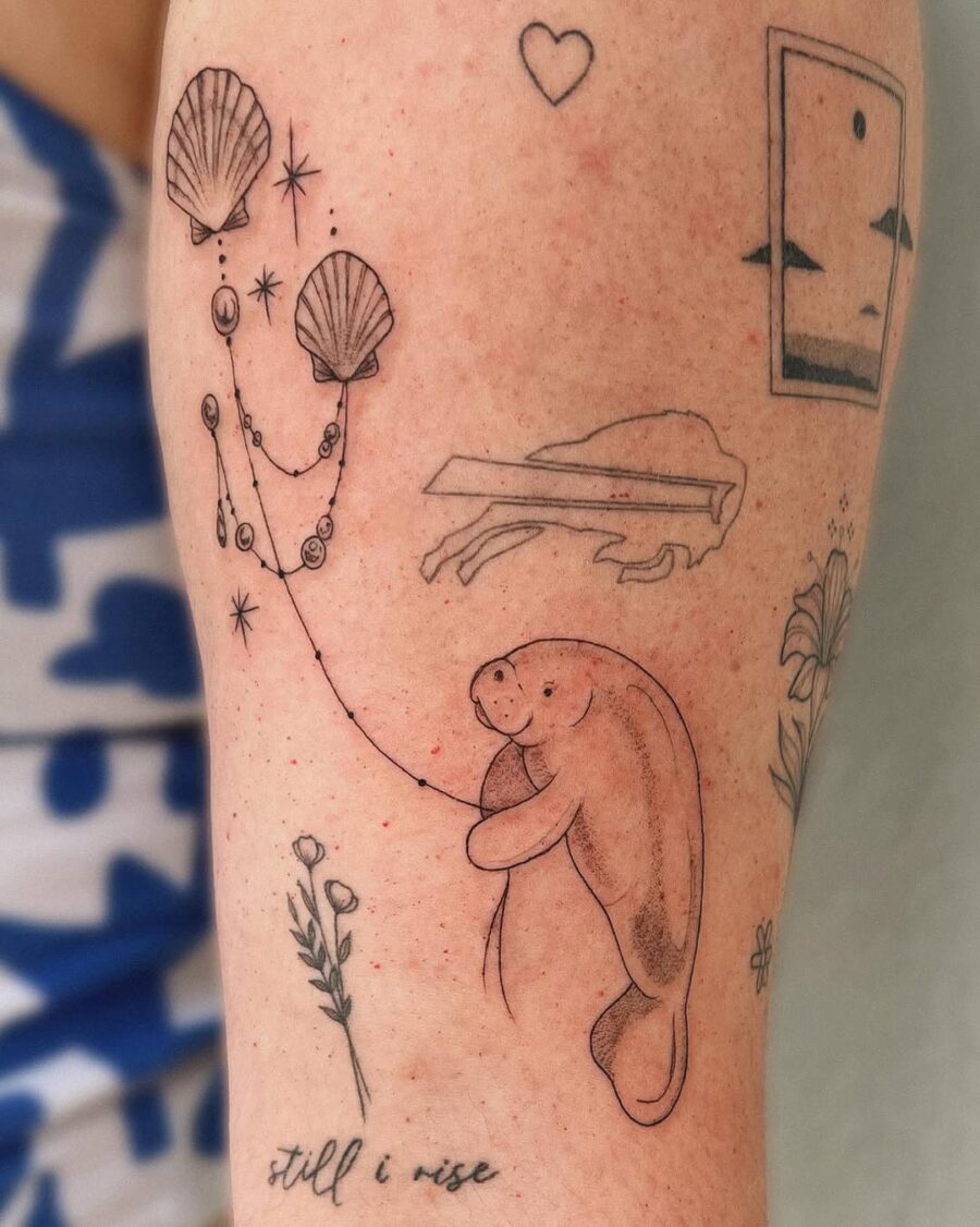 Charming Manatee Tattoo with Nature Elements Tattoo on skin