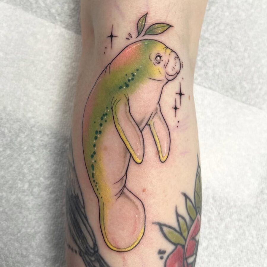 Charming Manatee Tattoo with Playful Details Tattoo on skin