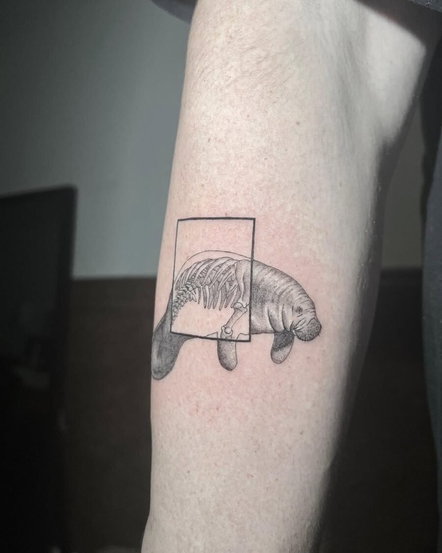 Unique manatee tattoo with ribcage design Tattoo on skin