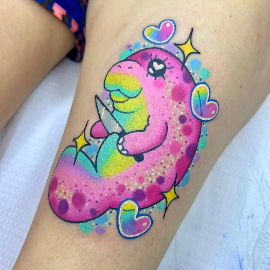 Vibrant manatee tattoo with playful vibes Tattoo on skin