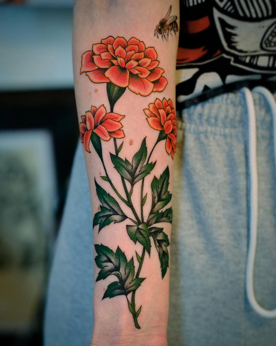 Beautiful marigold tattoos with vibrant colors Tattoo on skin