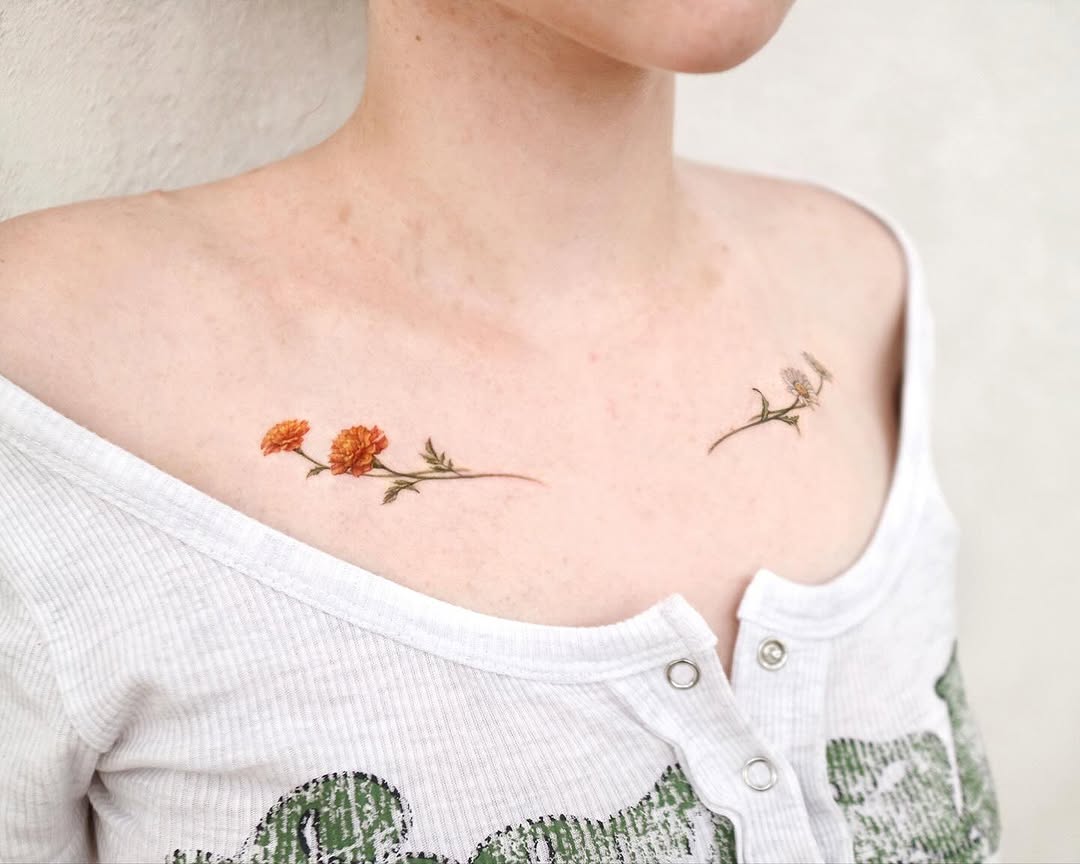 Delicate marigold tattoos gracefully adorn shoulders Tattoo on skin