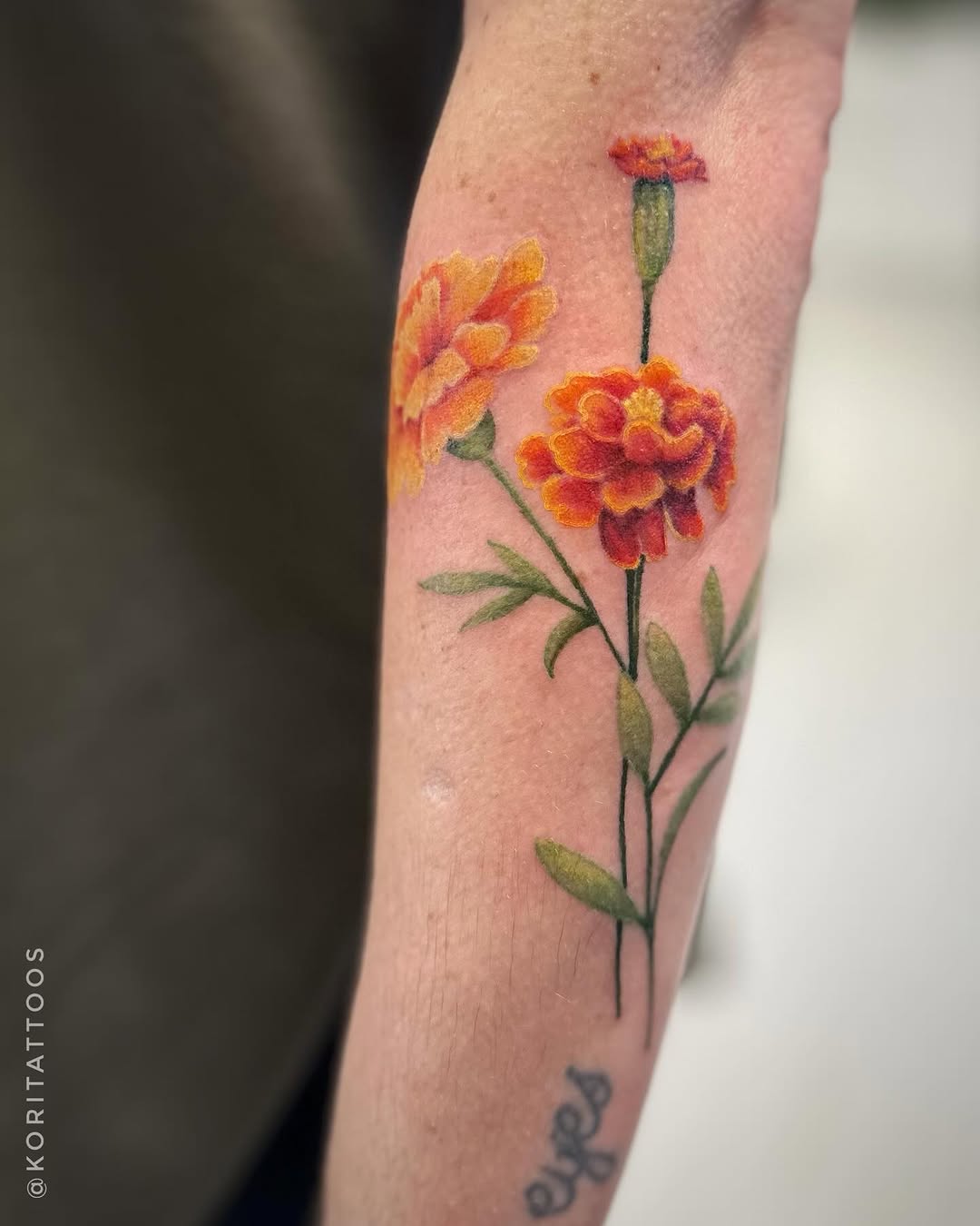 Stunning Marigold Tattoo with Bold Colors Tattoo on skin