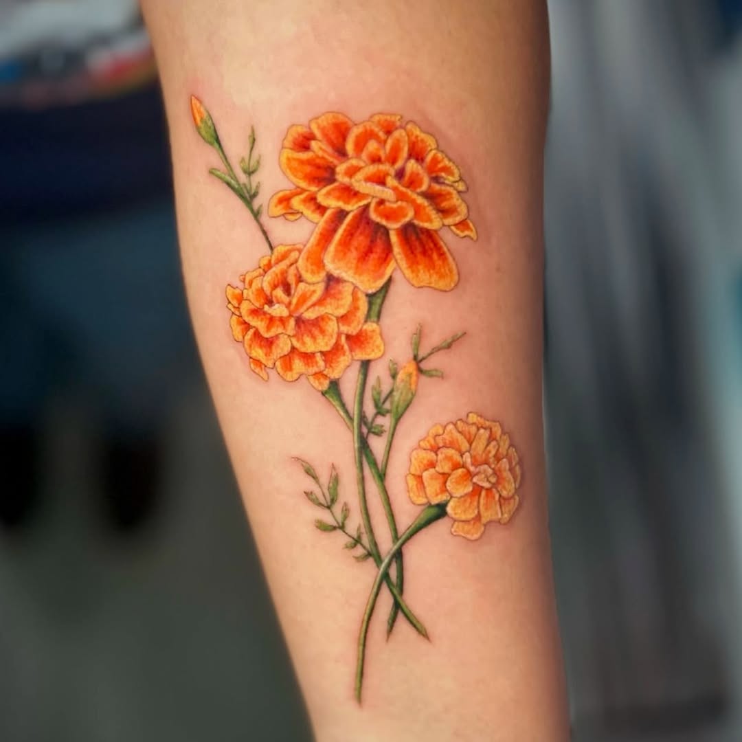 Vibrant marigold tattoo showcasing elegance and beauty Tattoo on skin