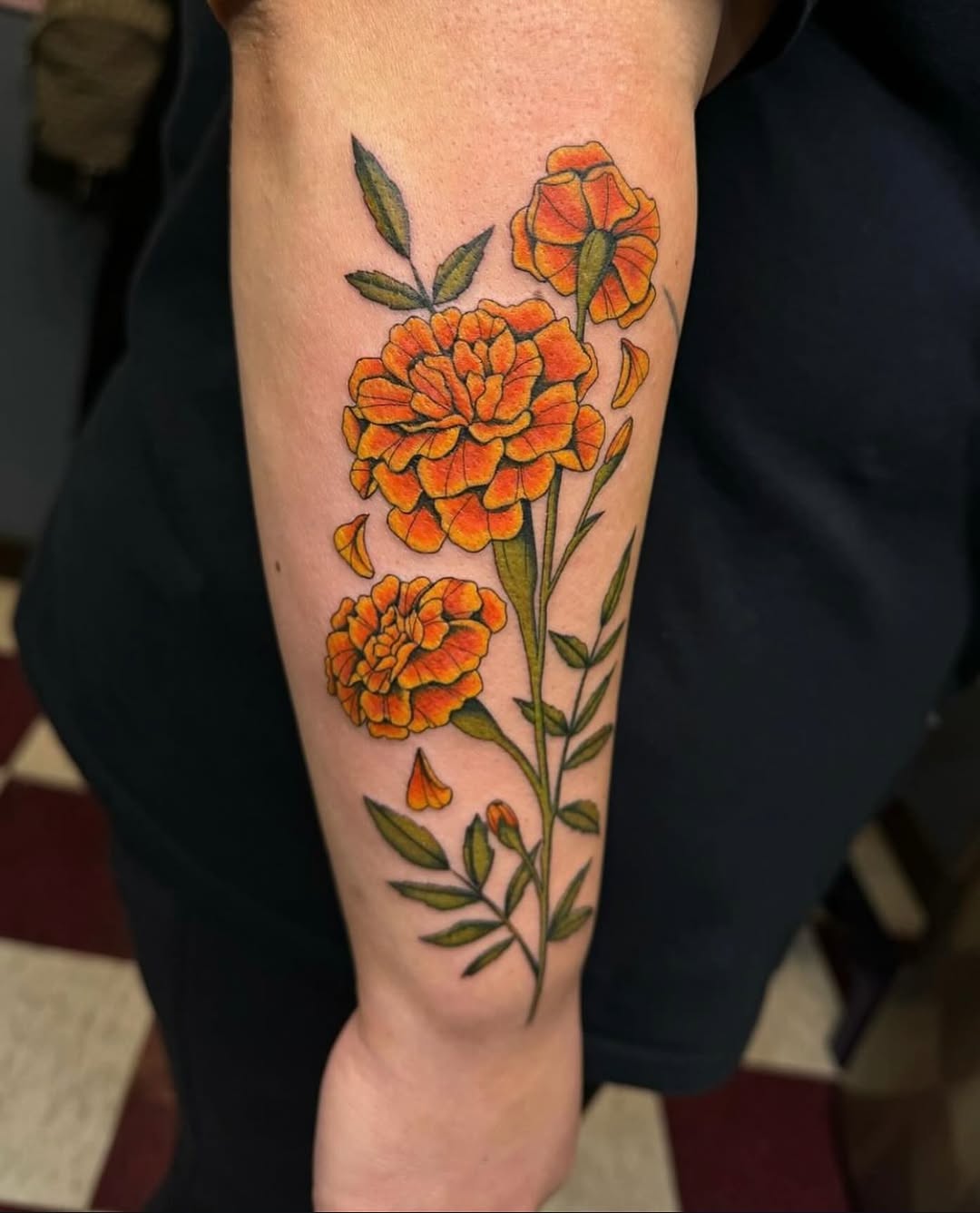 Vivid marigold tattoo showcasing floral beauty Tattoo on skin