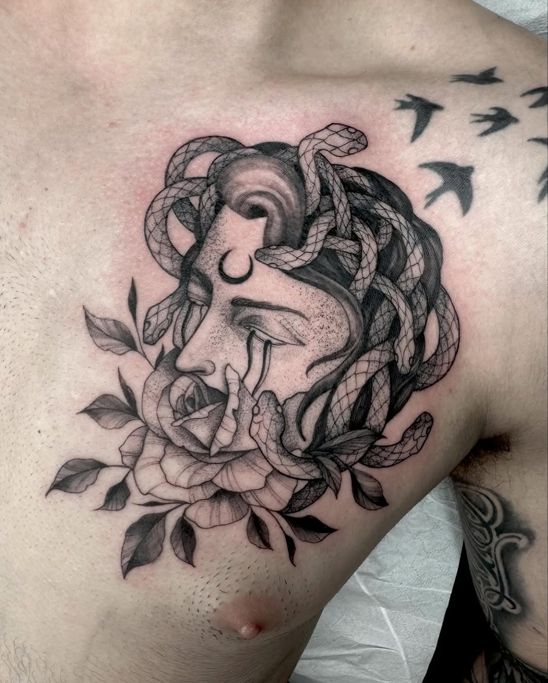 Intricate Medusa Tattoo with Floral Elements Tattoo on skin